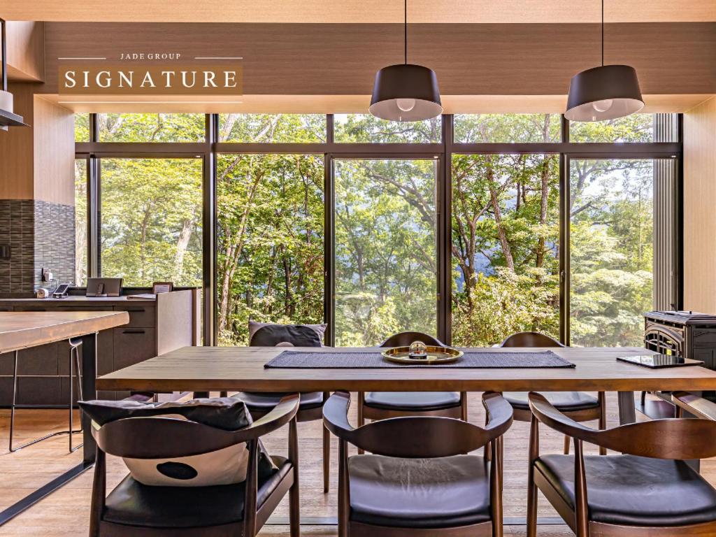 a large dining room with a large table and chairs at SUKH Hakuba Chalet by Jade Villa in Hakuba