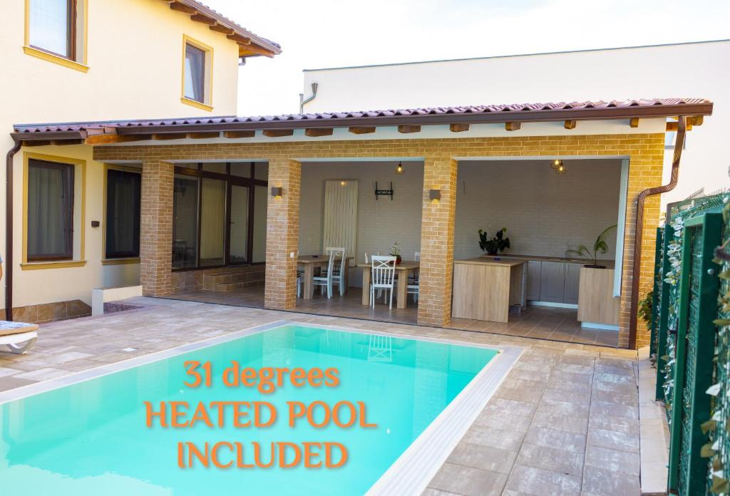 a house with a heated pool included at Casa cu Nuc in Alba Iulia