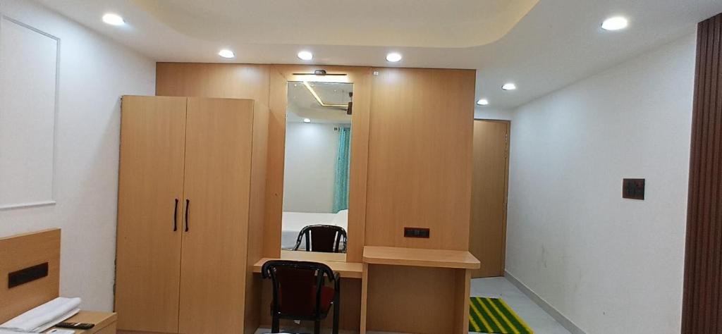 a room with a desk and a mirror at DEV PALACE saharsa in Saharsa