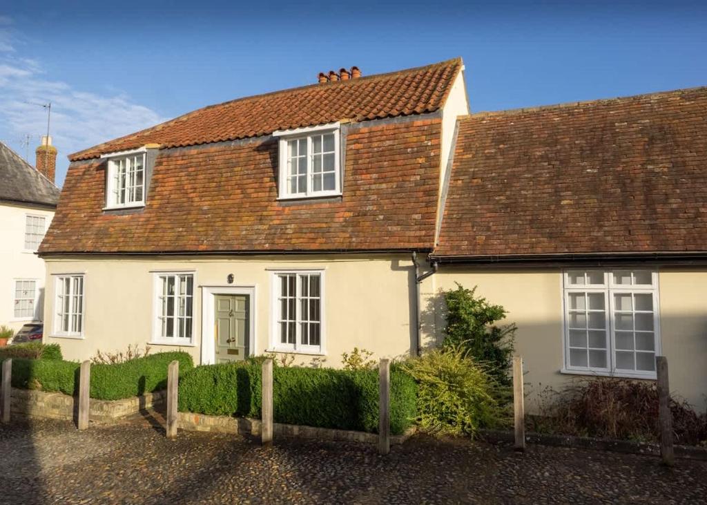 a white house with a brown roof at The Old Reading Rooms Linton in Linton