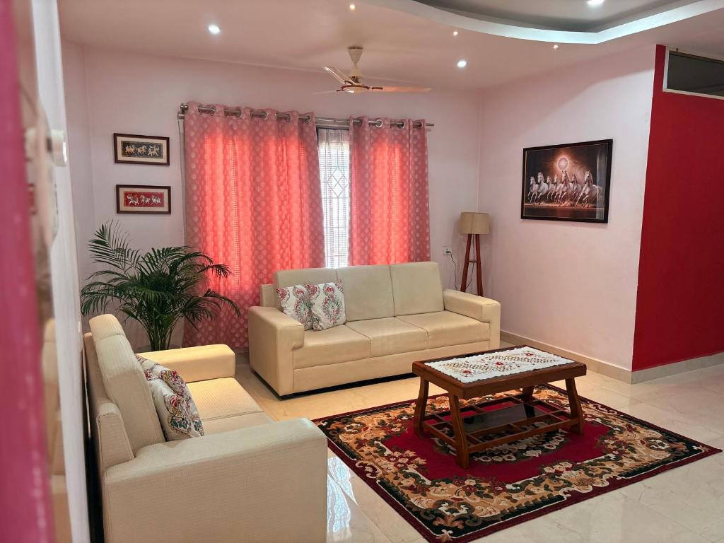 a living room with a couch and a table at Mi casa homestay in Guwahati
