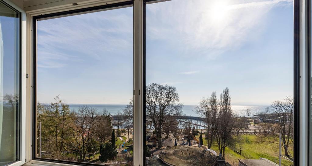 a view of the ocean from a window at PLAZA Hotel Buchhorner Hof in Friedrichshafen