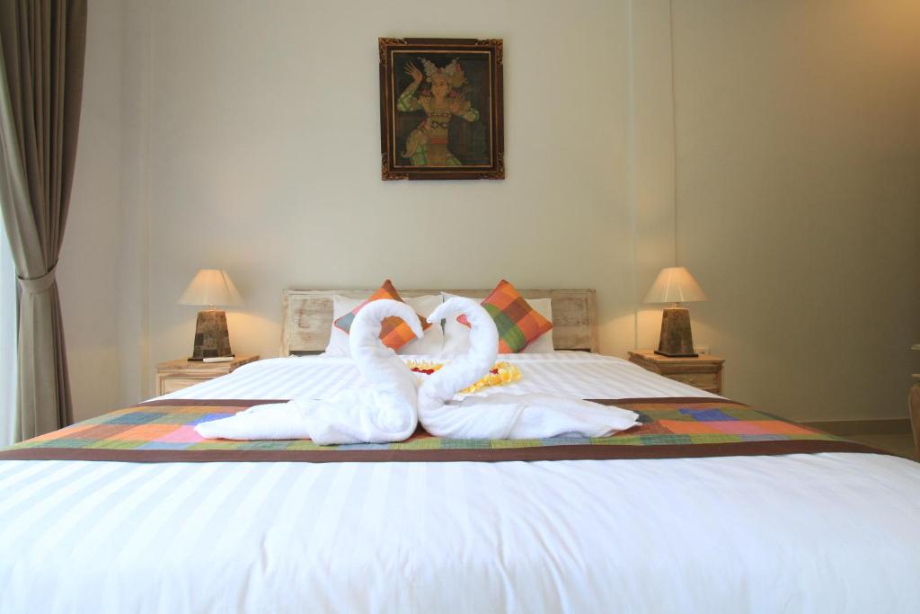 Postel nebo postele na pokoji v ubytování Gading Homestay Ubud