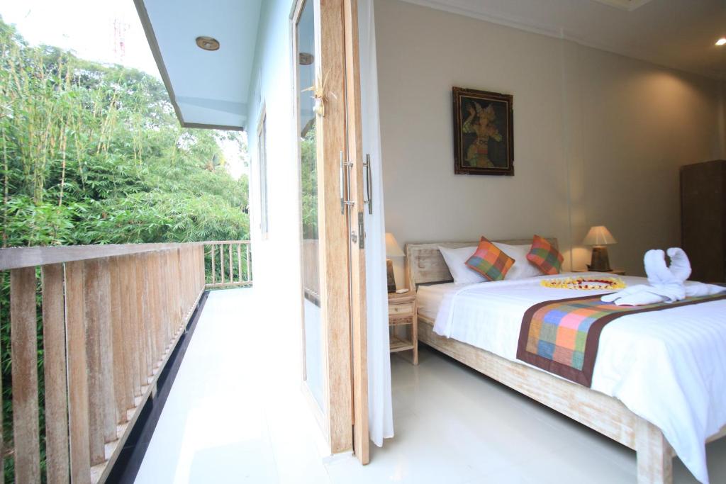 Postel nebo postele na pokoji v ubytování Gading Homestay Ubud