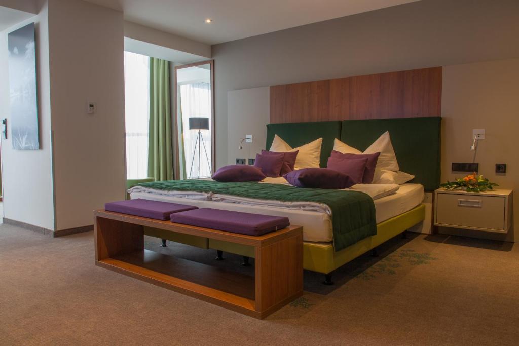 Postel nebo postele na pokoji v ubytování Ringberg Hotel