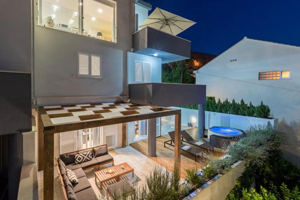 an aerial view of a house with a patio at Modern Penthouse Split with Jacuzzi & Terrace in Split
