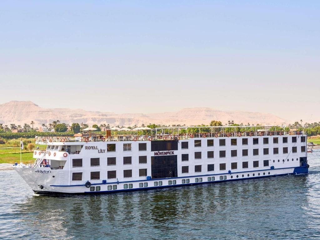 a large white cruise ship on the water at Mövenpick Royal Lily Nile Cruise, Every Monday Four Nights From Luxor, Every Friday Three Nights From Aswan in Luxor