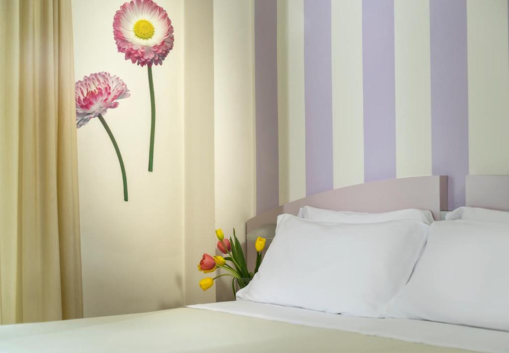 Postel nebo postele na pokoji v ubytování ACasaMia WelcHome Hotel