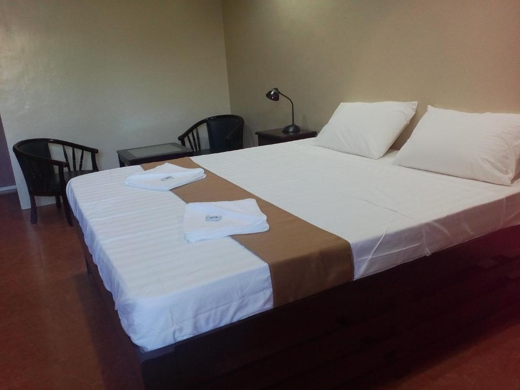 Postel nebo postele na pokoji v ubytování Mañana Hotel