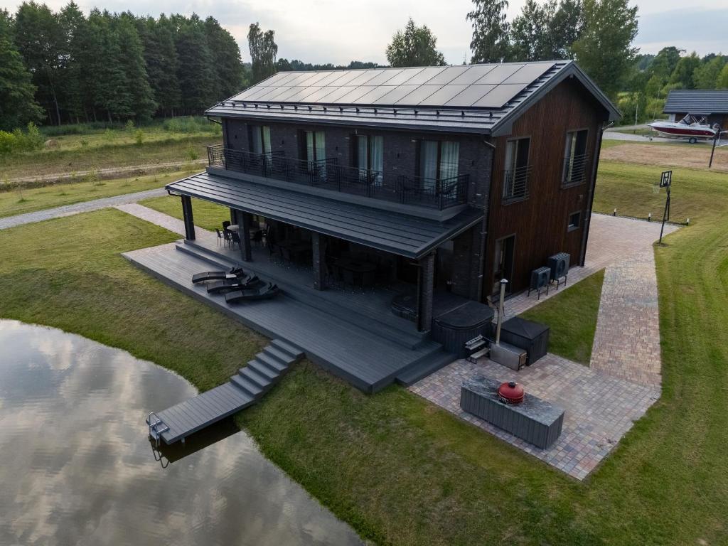 an overhead view of a house on the water at Galuonu Vilos Vip vila in Inturkė
