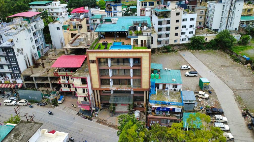 an overhead view of a city with buildings at Hotel Divine Lakshmi Ganga in Rishīkesh