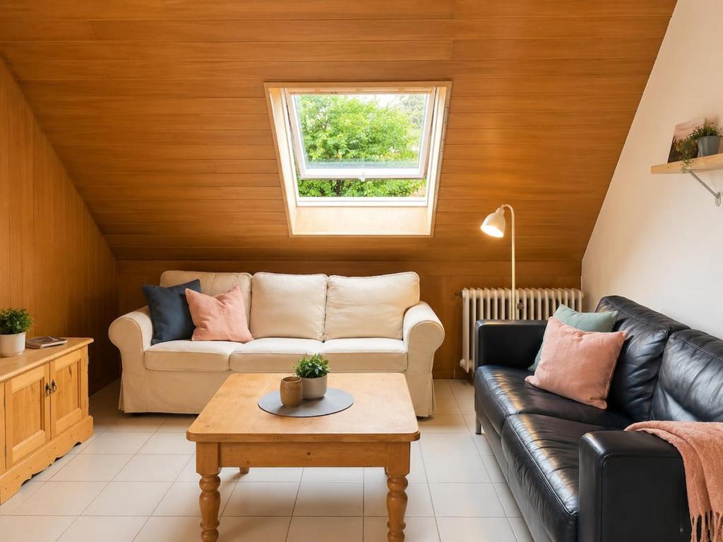 a living room with a couch and a table at Odw homes - 3Room Apartment for Workers in Weinheim