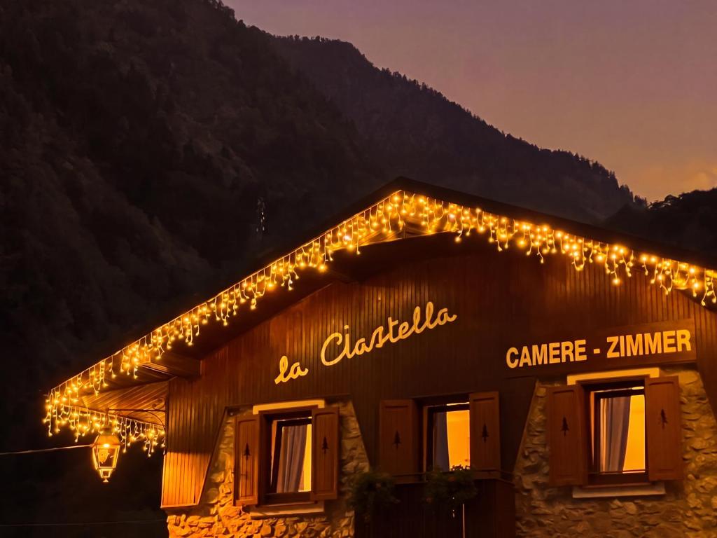 a building with christmas lights on it at Meublé la Ciastella in Vinadio