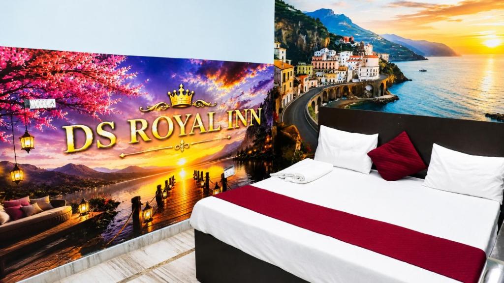 a bedroom with aamicamic view of the city of rous royale at Ds Royal Inn in Malhour