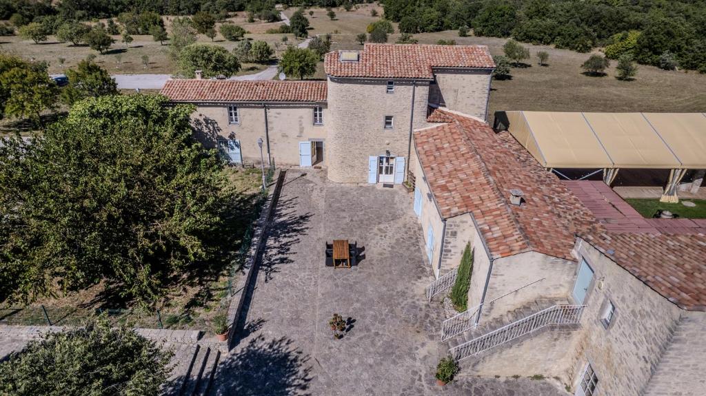 an aerial view of a large stone house at Mas De Baumes in Ferrières-les-Verreries