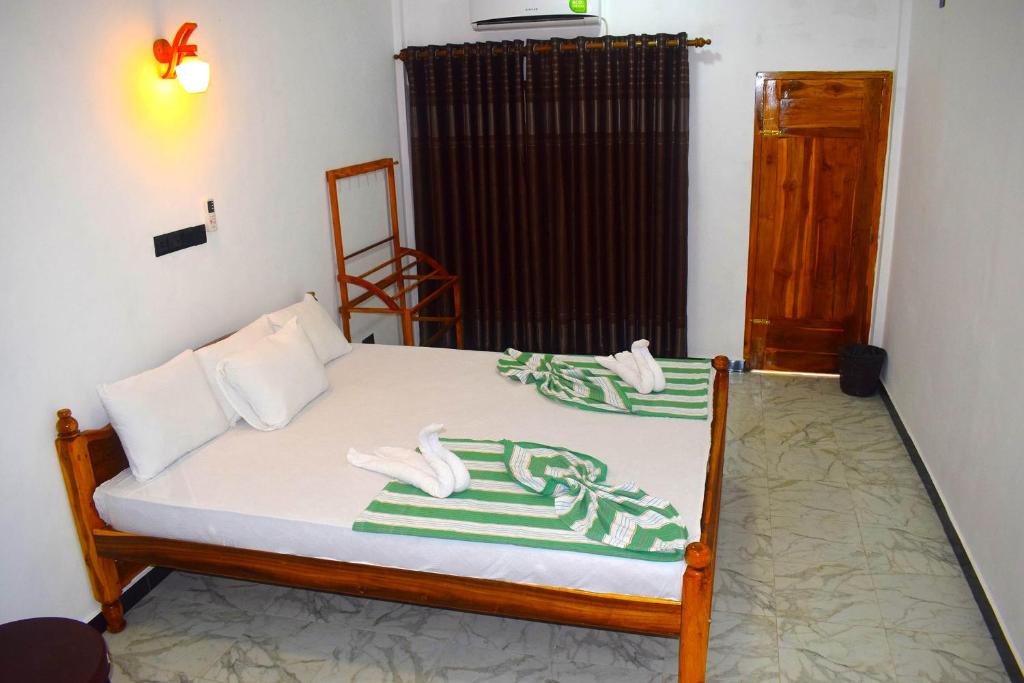 Postel nebo postele na pokoji v ubytování Palm Beach Resort by Yosha Guest