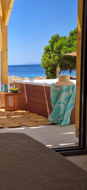 a view of the ocean from a balcony with a view at Porto Paradiso Seaside Resort in Vromolimnos