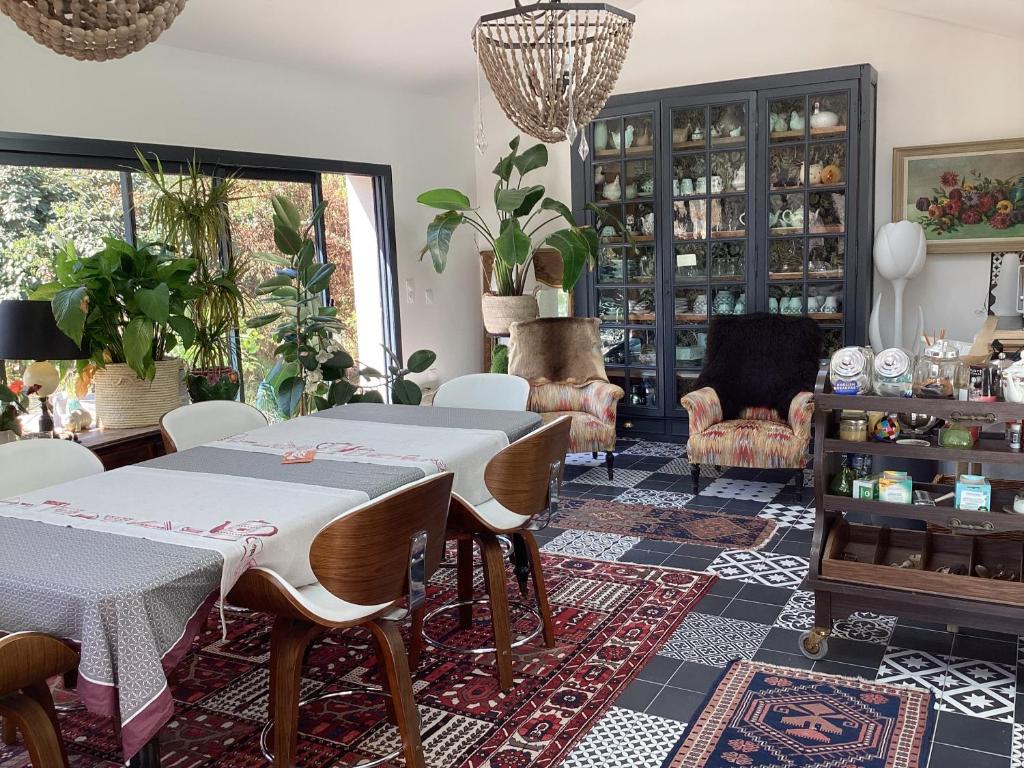 a dining room with a table and chairs at A la guiniere in Couëron