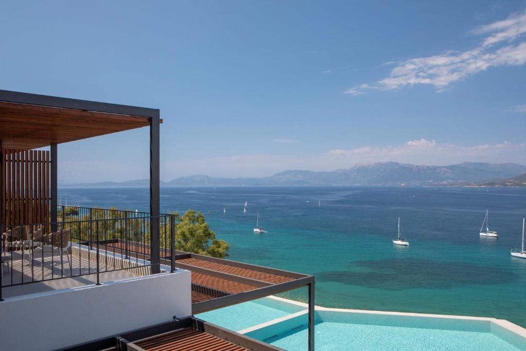 a view of the ocean from the balcony of a house at Zoe Sea View Villas in Paleros