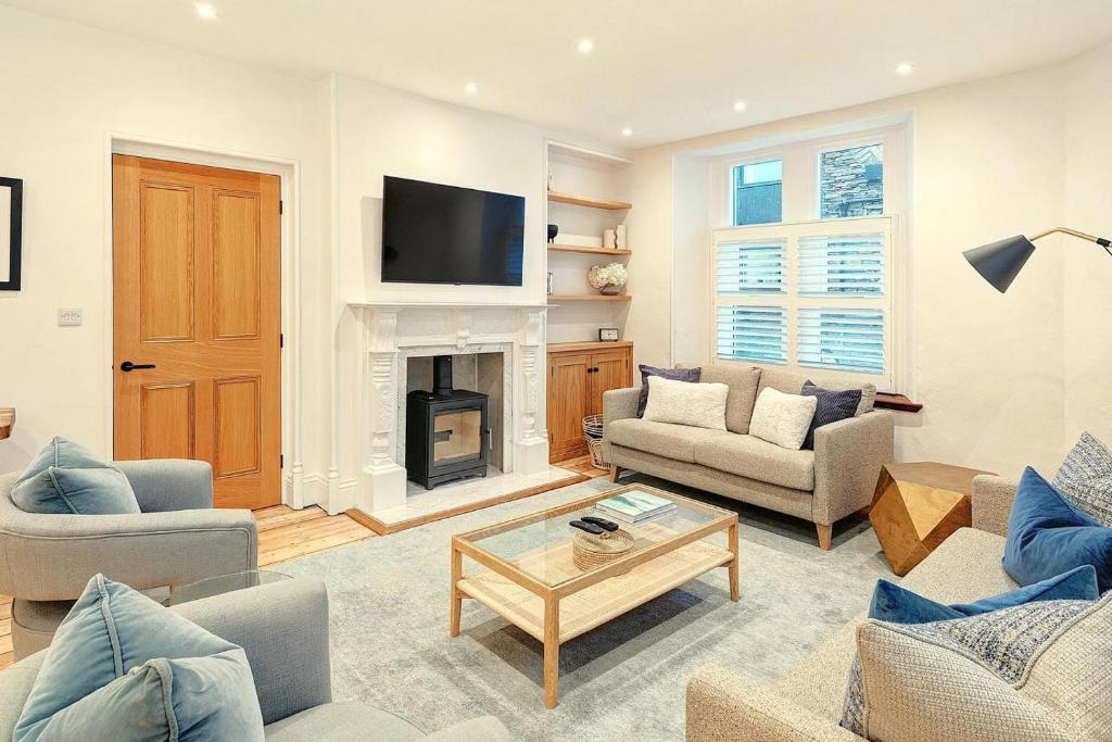 a living room filled with furniture and a fireplace at 4 Bed in Windermere oc-lr026 in Windermere