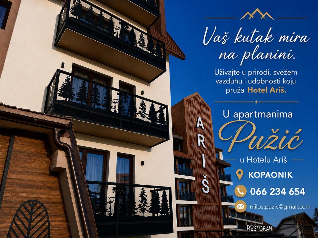 a sign for a hotel with a balcony at Apartmani Pužić in Kopaonik