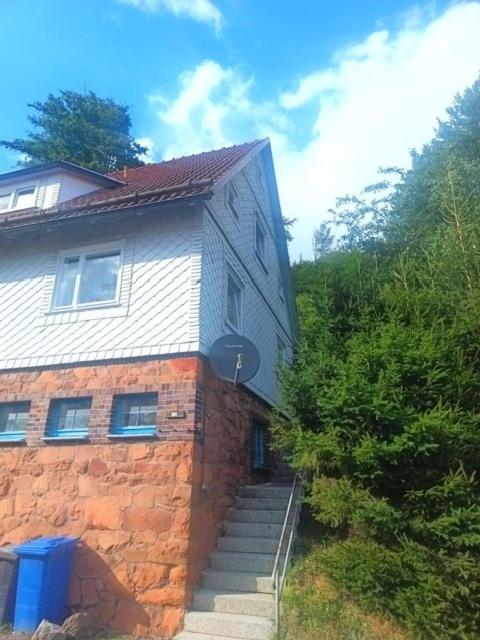 a brick house with stairs leading up to it at Werrapark Apart Heubach in Masserberg