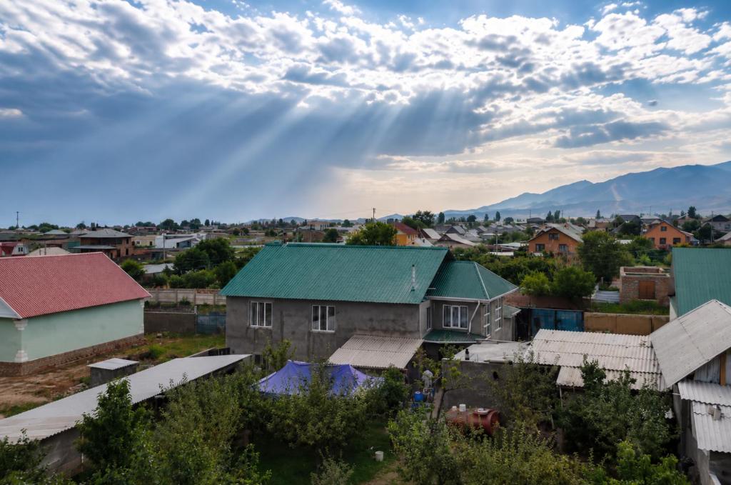 an aerial view of a small town with buildings at Khan Dobo in Bokonbayevo