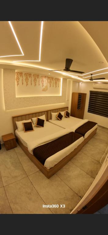 a bedroom with two beds in a room at Palazhi Inn in Trivandrum