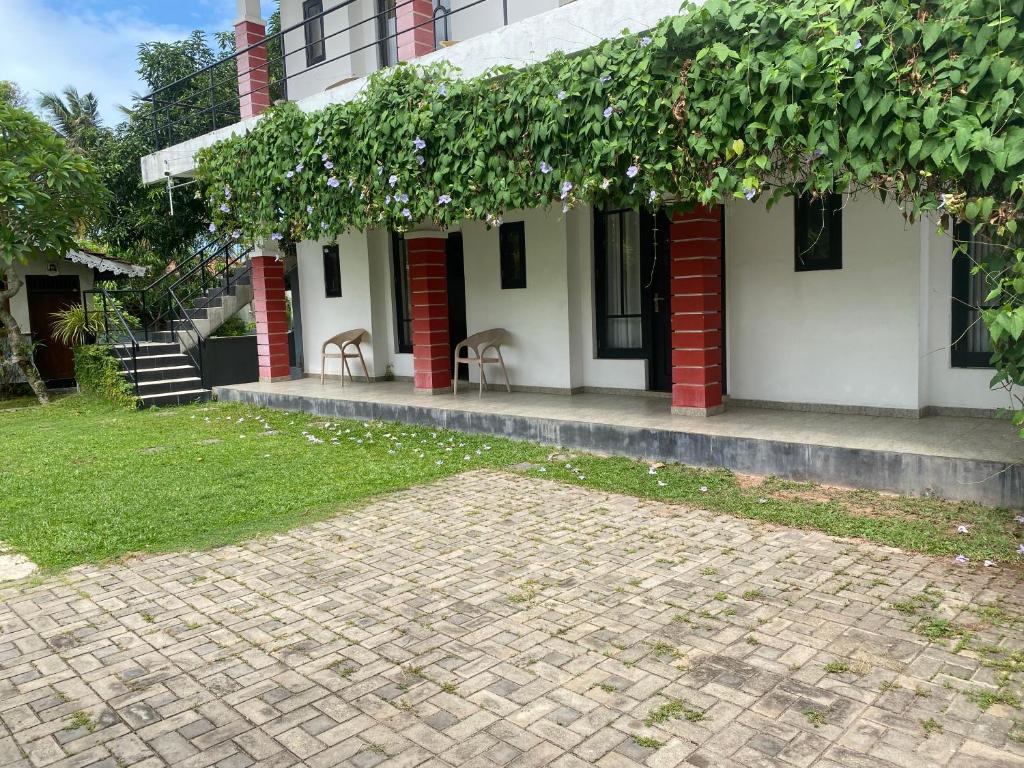 a house with a brick driveway in front of it at Sea Tide by Jade Rock in Negombo