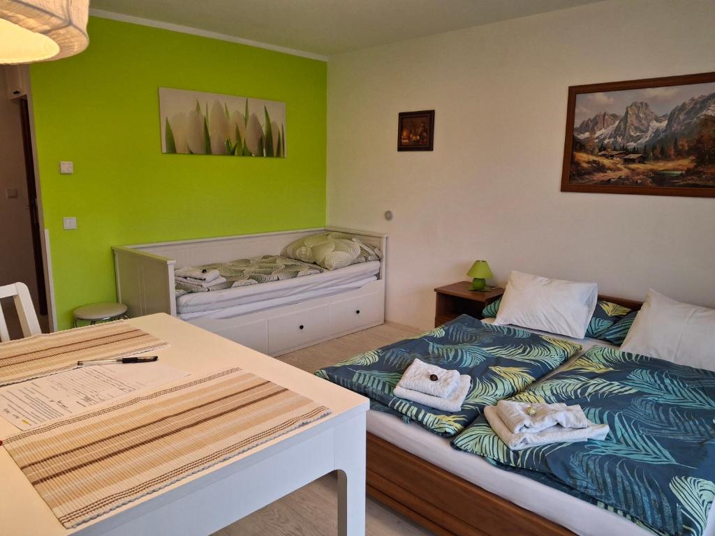 a small room with a bed and a table at Ferienwohnung 6 Bergblick in Sankt Gilgen