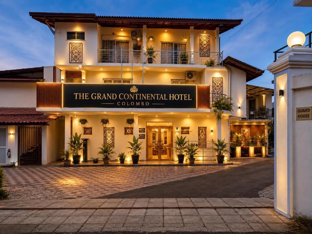 a hotel with a sign that reads the grand continental hotel at The Continental Hotel in Seeduwa