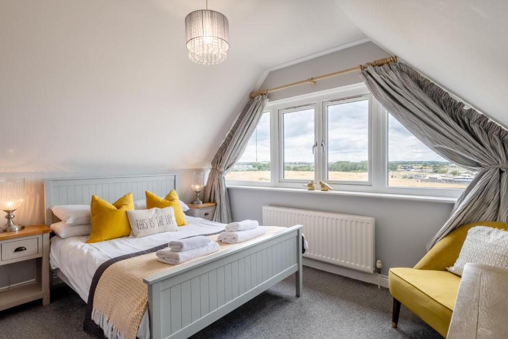 a bedroom with a bed and a window at 4 Bed in Amble oc-gd1868 in Amble