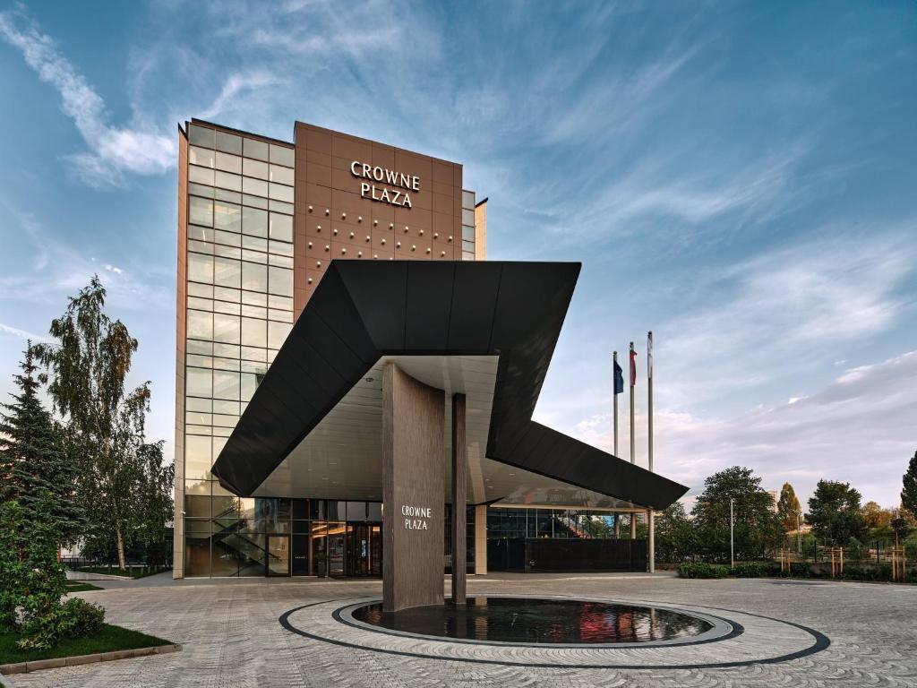 a building with a large sculpture in front of it at Crowne Plaza Sofia by IHG in Sofia
