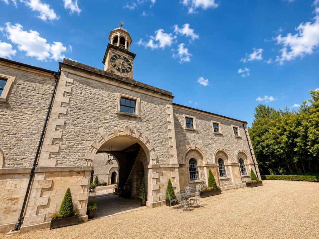 a building with a clock tower on top of it at Marske Stables, Yorkshire Dales in Marske