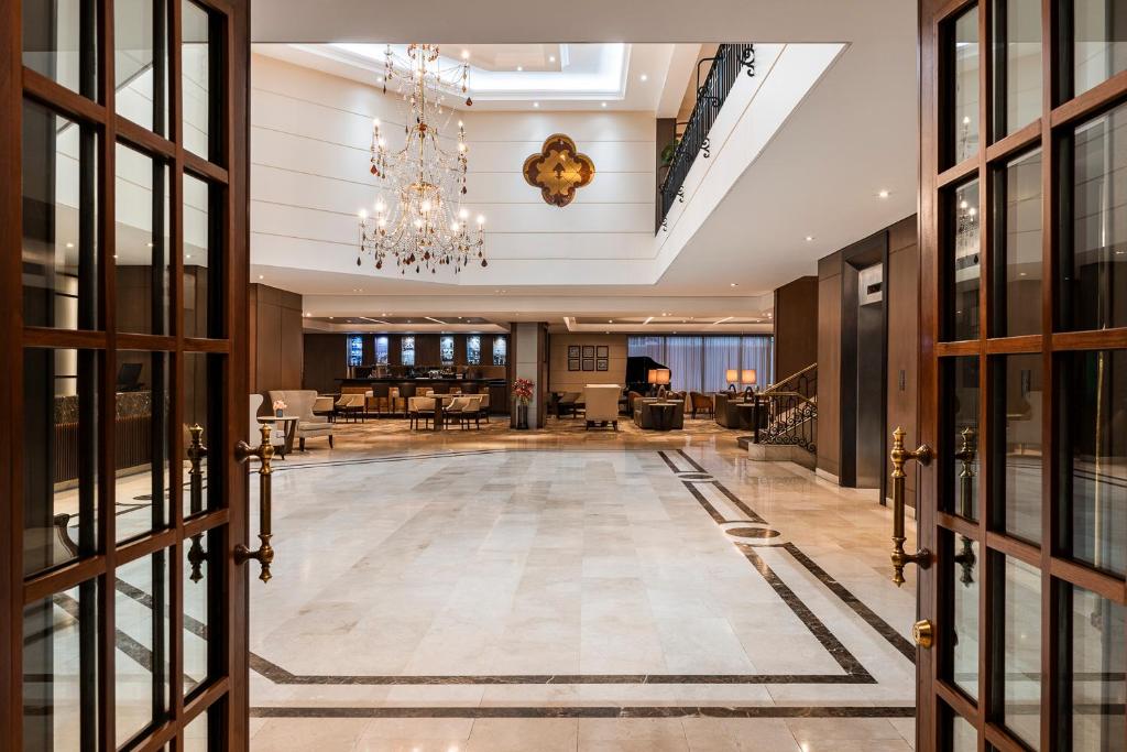 a view of a lobby with a chandelier at Hotel Dann Carlton Bogota in Bogotá