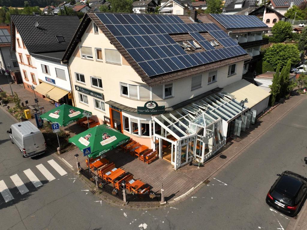 an overhead view of a building with solar panels on it at Hotel Es Lämmche in Breuberg