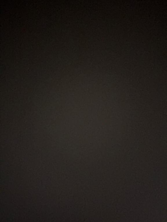 a dark room with a plane flying in the sky at 11sda in Jošanička Banja