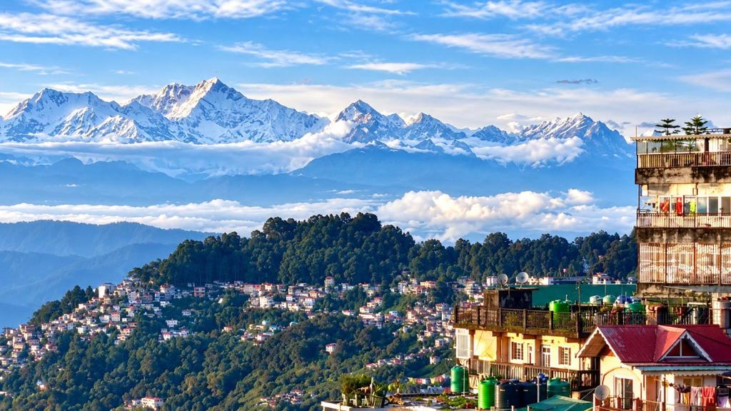 a view of a city with mountains in the background at The Boho Darjeeling Stays in Darjeeling