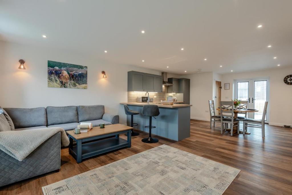 a living room with a couch and a kitchen at 2 Bed in Otterden oc-c36010 in Otterden