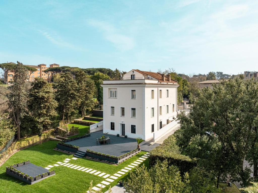 an aerial view of a white house with a yard at Monastero San Pietro Claver in Rome