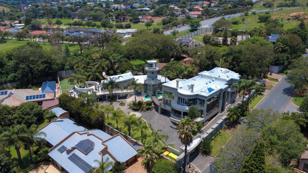 an aerial view of a house with a clock tower at Silva Villa in Bedfordview