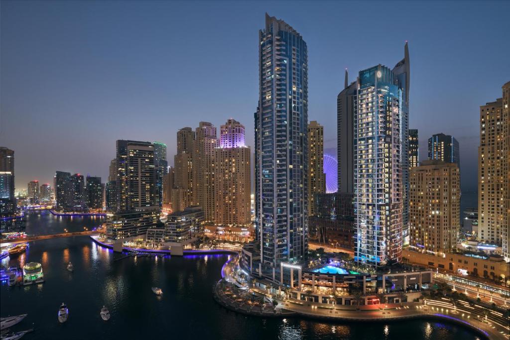 a view of a city skyline at night at InterContinental Dubai Marina by IHG in Dubai