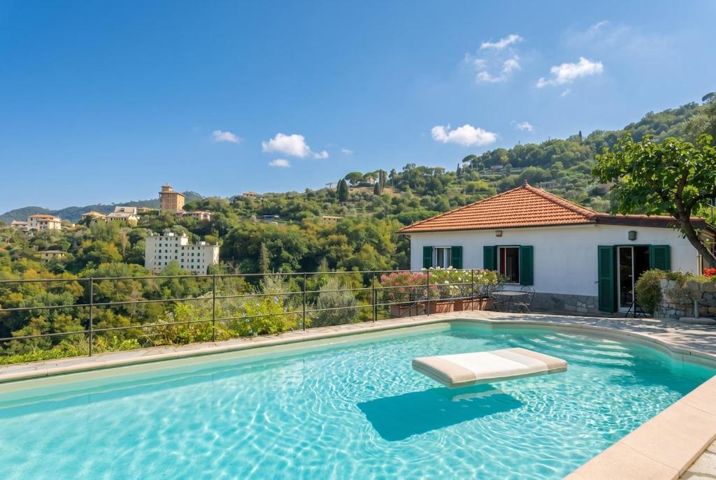 a swimming pool in front of a house at Villa with Pool e Jacuzzi Free Parking AC in San Lorenzo della Costa