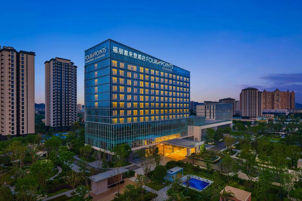 a rendering of a building in a city at Four Points by Sheraton Leshan in Leshan