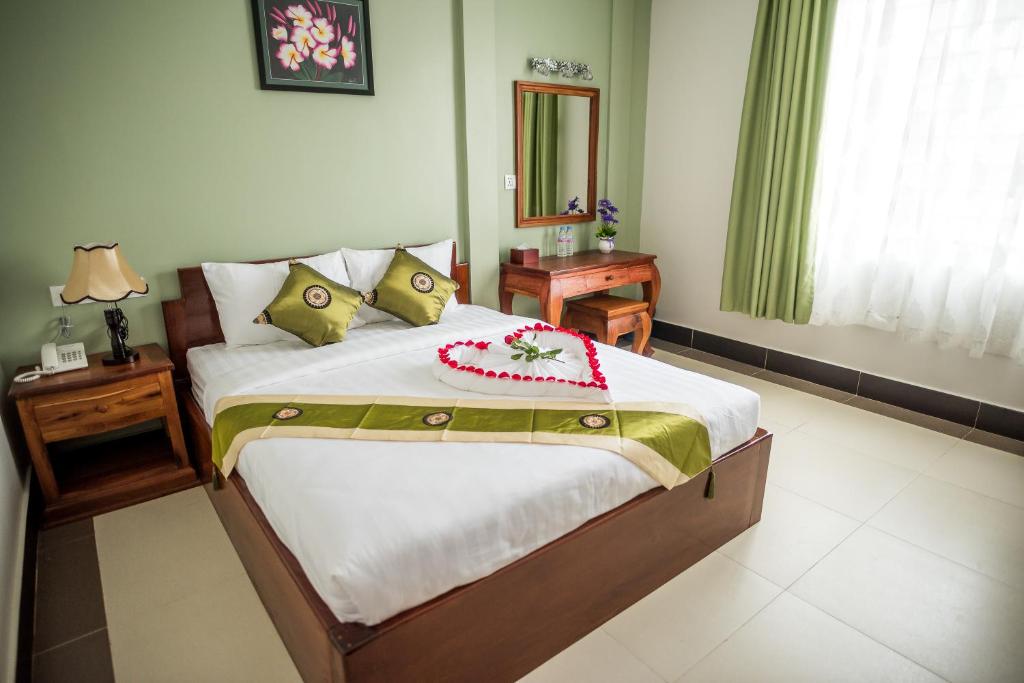 Postel nebo postele na pokoji v ubytování NKS Hotel