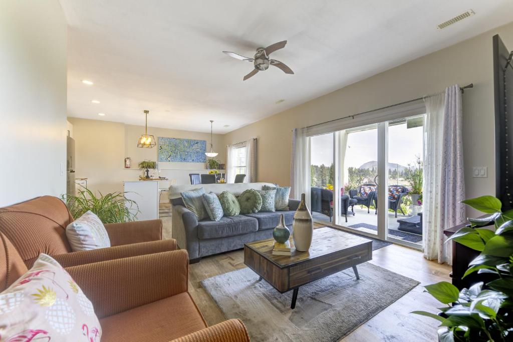 a living room with a couch and a table at Unwind centrally in West Kelowna