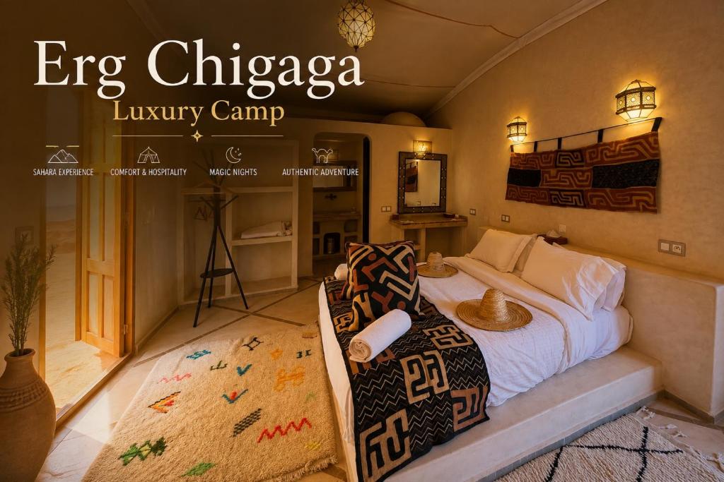 a bedroom with a bed and a living room at Erg Chigaga Luxury Camp in El Gouera