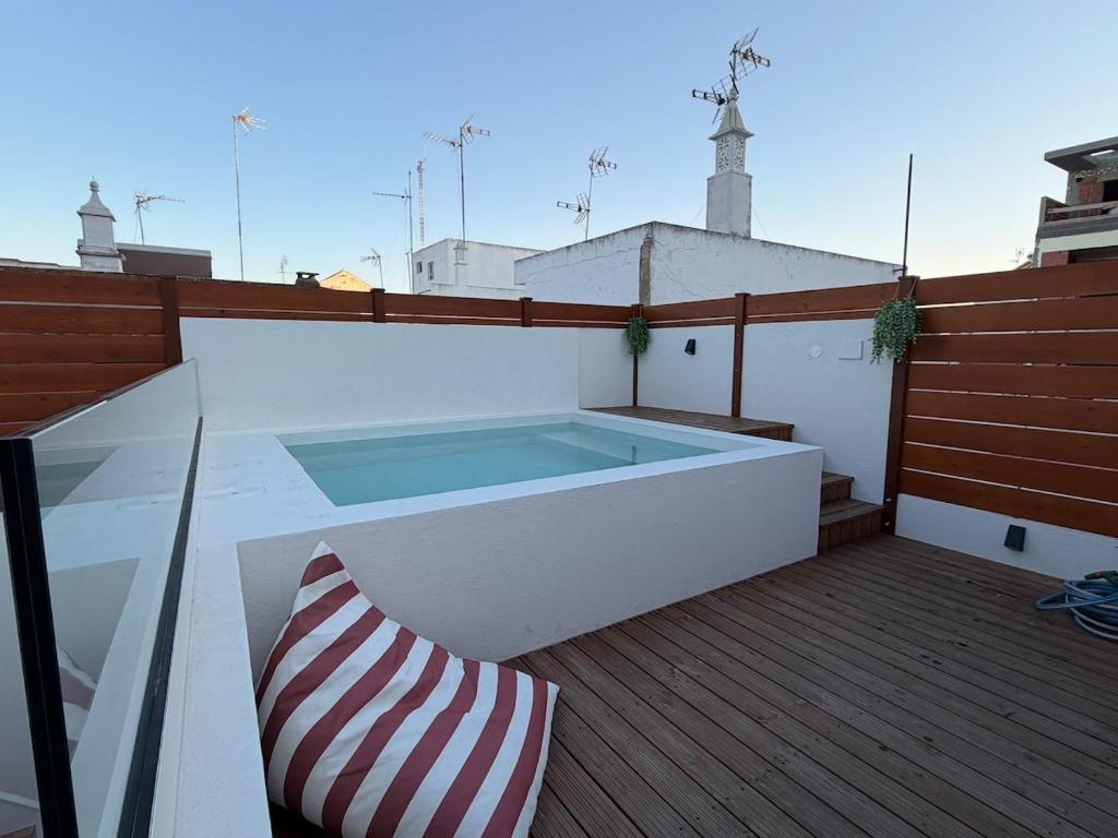 a balcony with a swimming pool on a roof at AL do Barão - Casa de Charme com Piscina Privada in Vila Real de Santo António