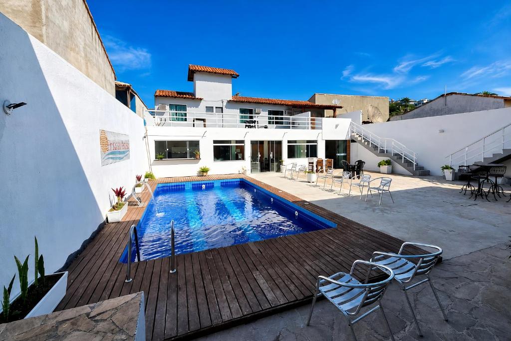 a house with a swimming pool on a deck at Pousada Brisas de Búzios in Búzios