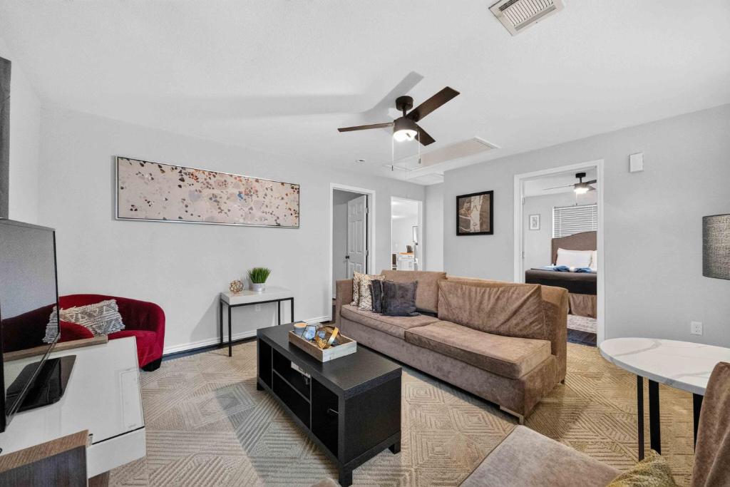a living room with a couch and a ceiling fan at Cozy Heights 2 BD Bungalow, Walkable in Houston